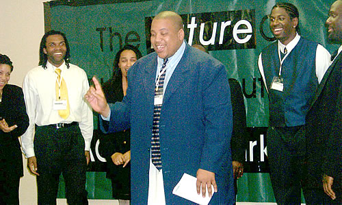 Colby speaking on stage, Los Angeles, California Black Business Seminar