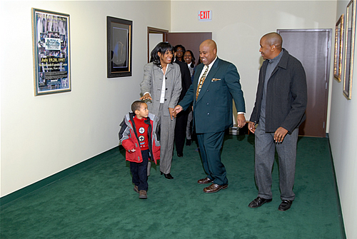 Delxino greets Hope, Victor and son as they enter the Holding Room, TAG TEAM Marketing Atlanta Facility Grand Opening