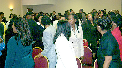 Audience participating in group exercise, Los Angeles, California Black Business Seminar