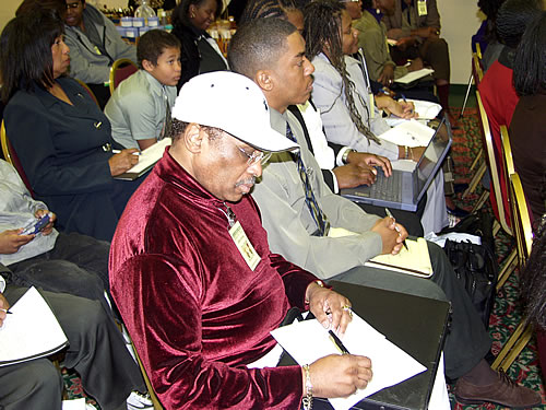 Brothes and sisters taking notes, Los Angeles, California Black Business Seminar