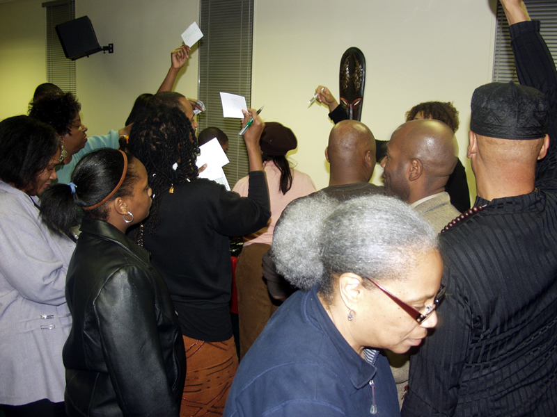 Brothers and Sisters participating in the TAG TEAM Stock Trading Game, Introduction To Black Investing Seminar w/ Delxino
