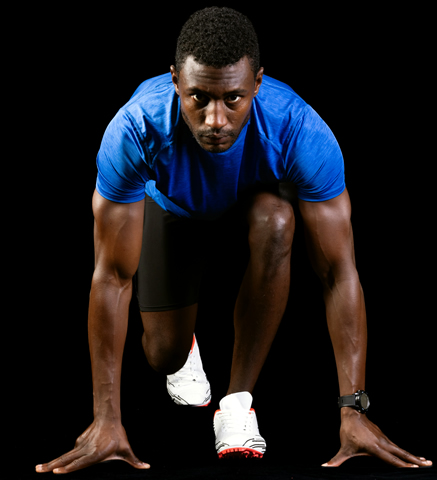 Runner in starting blocks