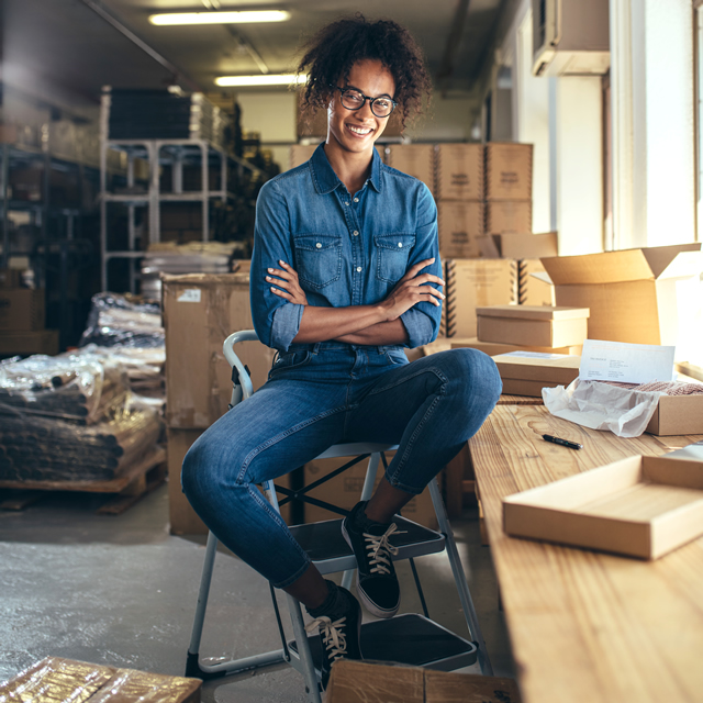 Sister Sitting In Warehouse