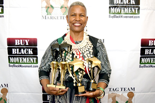Dorothy Cooper holding her trophies