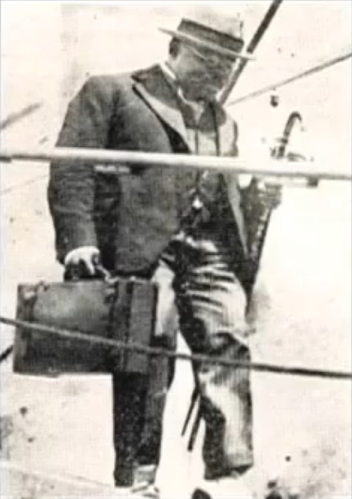 Marcus Garvey leaving a ship, walking down the gangplank