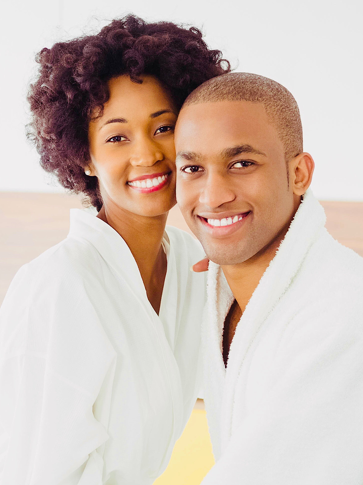 Black Couple In Bathrobes Smiling