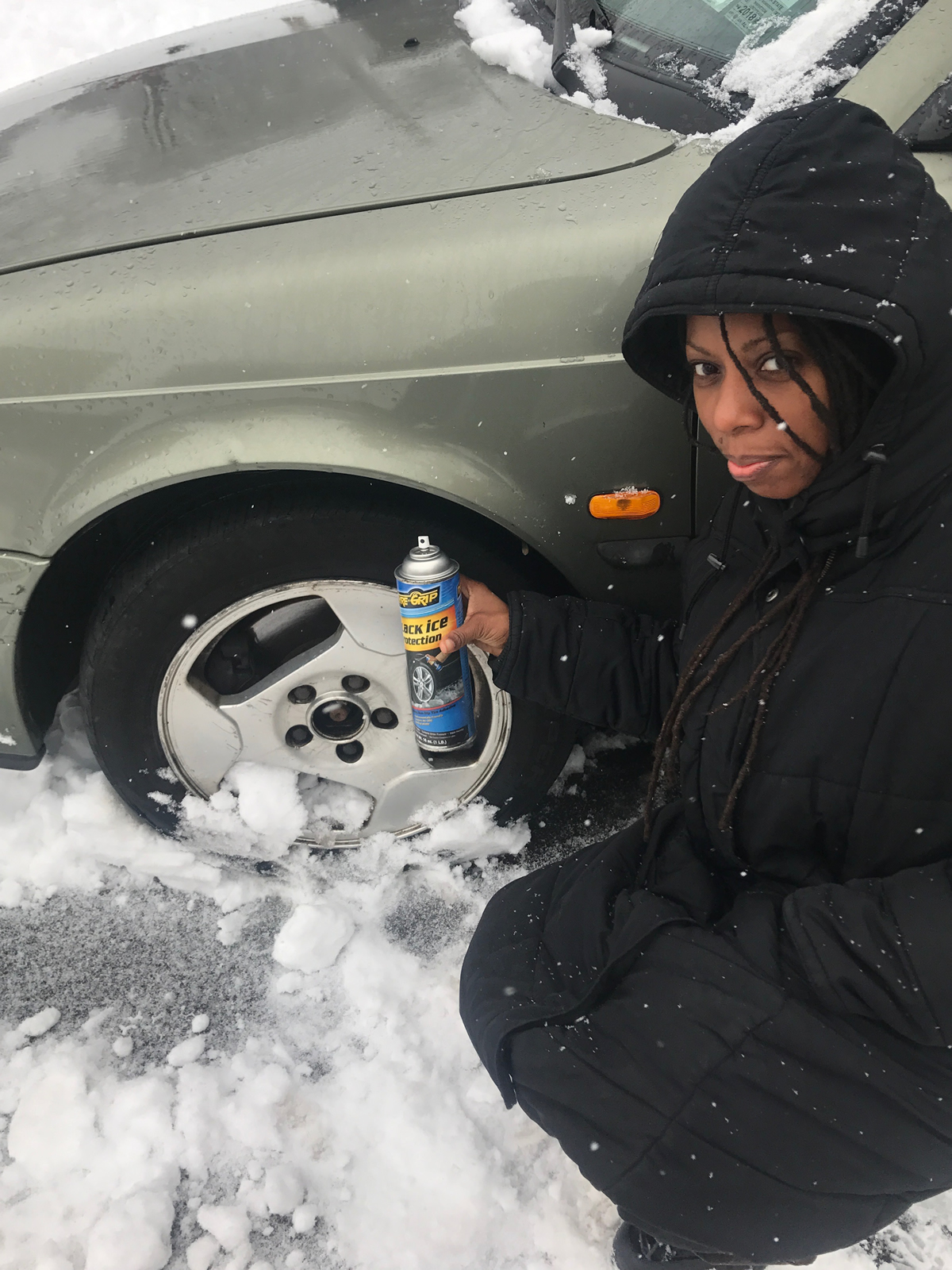 Sister Applying Tyre Grip Non-Stick Spray To Her Tire