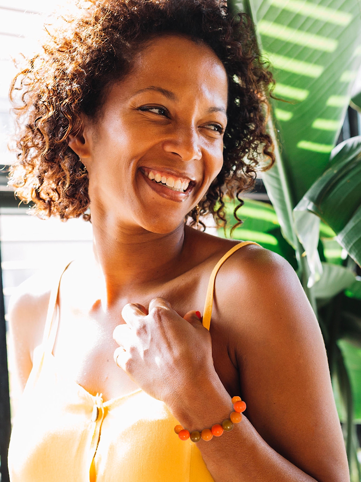 Woman wearing orange bracelet