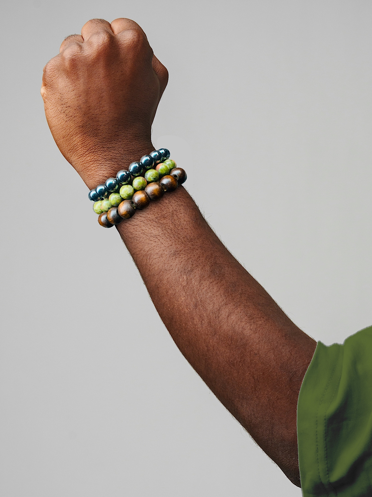 Man wearing Unakite, Hematite and Wood bracelets